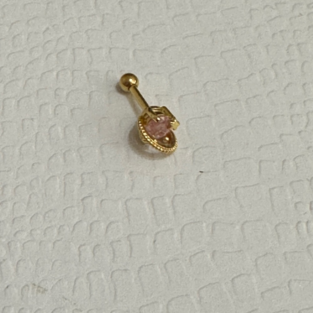 Gold nose ring.